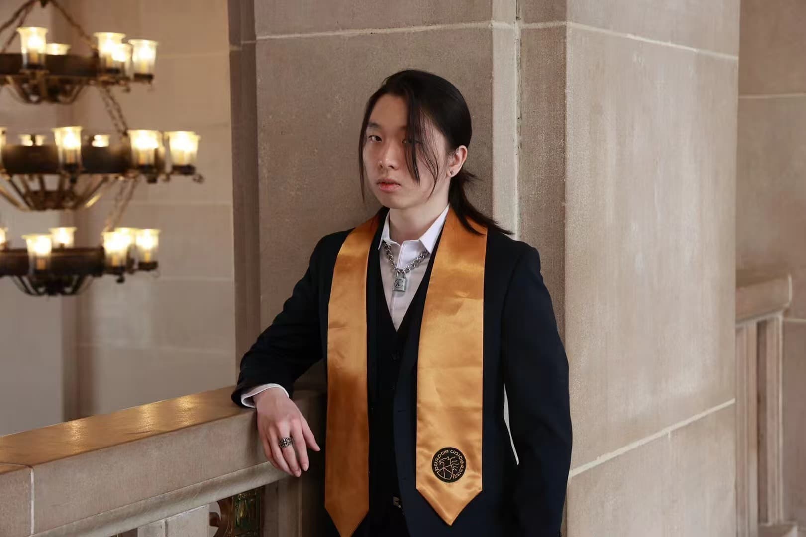 Vince Wen in academic graduation attire.